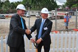 Federal Infrastructure Minister Anthony Albanese (left) and ABC chairman Maurice Newman turn a sod at the site of the ABC's future Brisbane site.