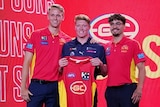 Matt Rowell is presented with his Gold Coast Suns guernsey at the AFL Draft.
