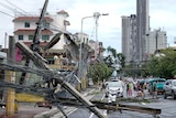 Power lines down on the road after the typhoon hit