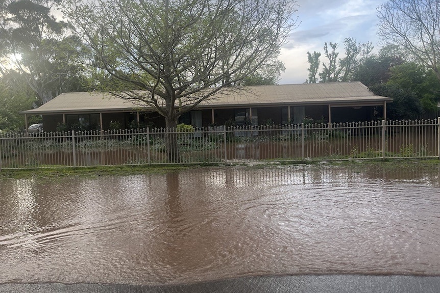 A house surrounded by floodwater.