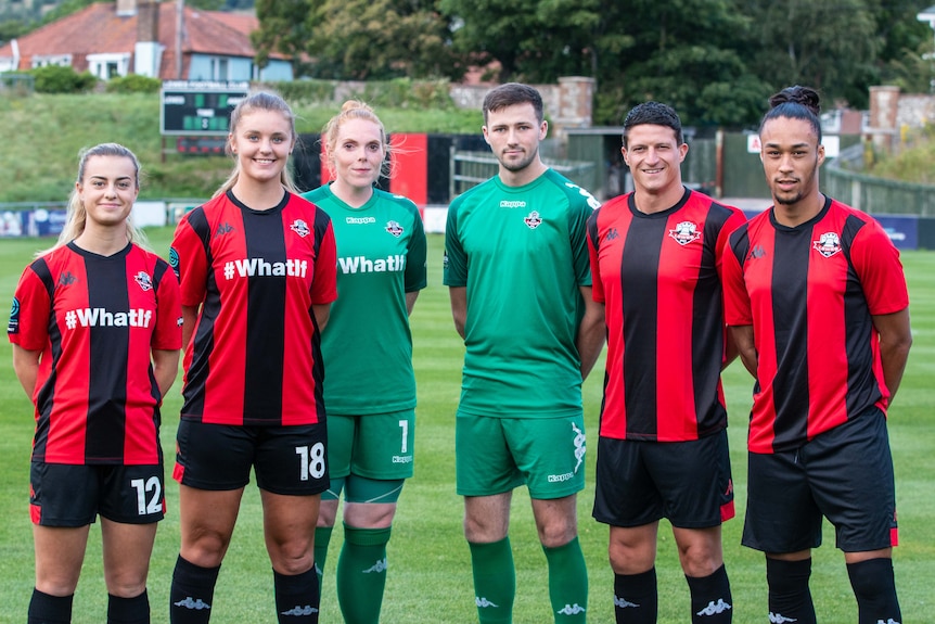 Lewes FC players pose for a photo