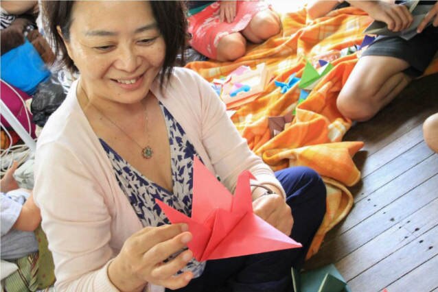 Woman holding origami crane