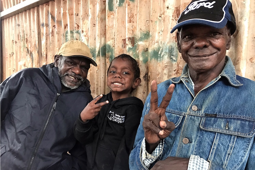 Ahead of the arrival of a tropical low people in the Tiwi Islands are in good spirits as they take shelter.