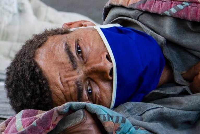 A homeless man sleeps at a homeless shelter in Cape Town, South Africa, Sunday March 29, 202