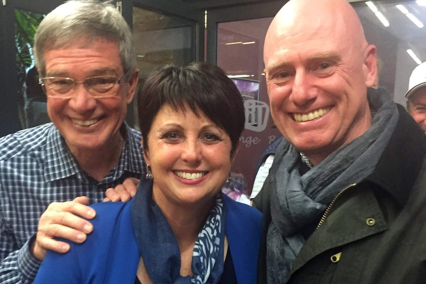 Mike Nahan, Alyssa Hayden and Sean L'Estrange smile while posing for a photo.