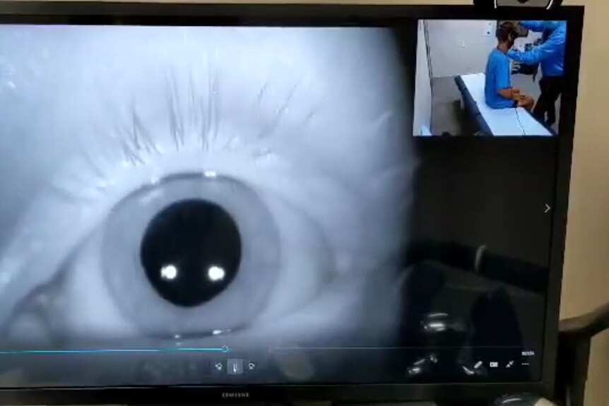 A screen with a large image of an eye.
