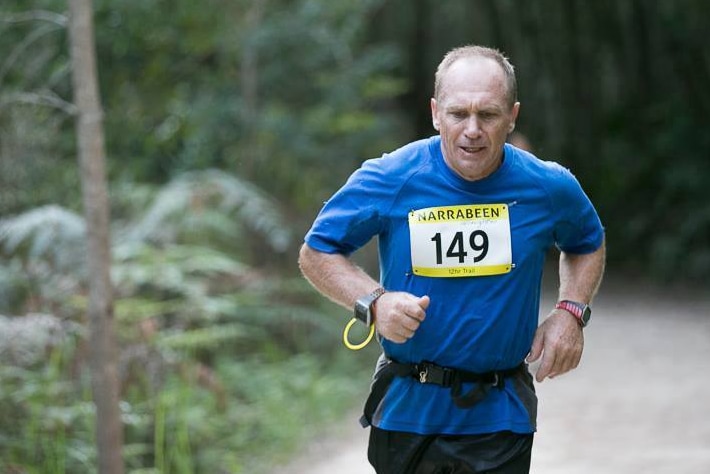 Greg brown runs on a dirt track during a 12-hour marathon in Narrabeen.