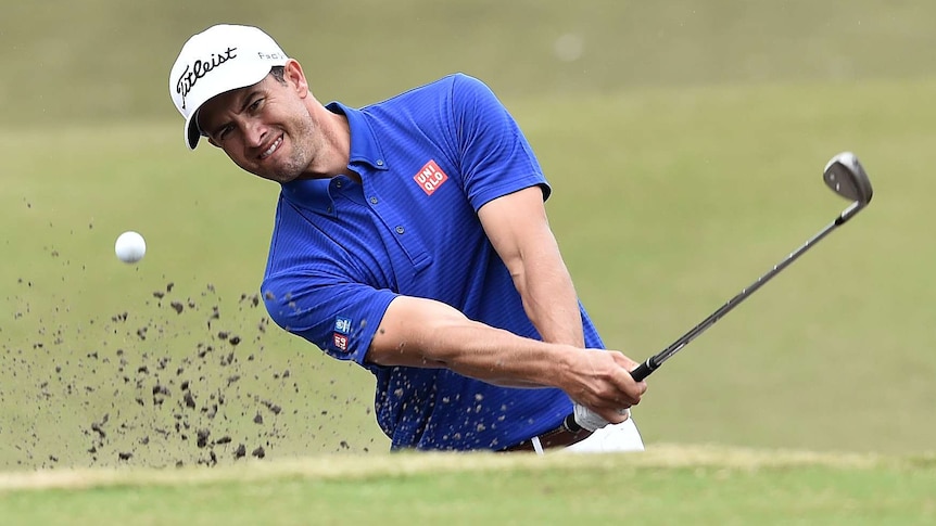 Adam Scott plays out of the bunker
