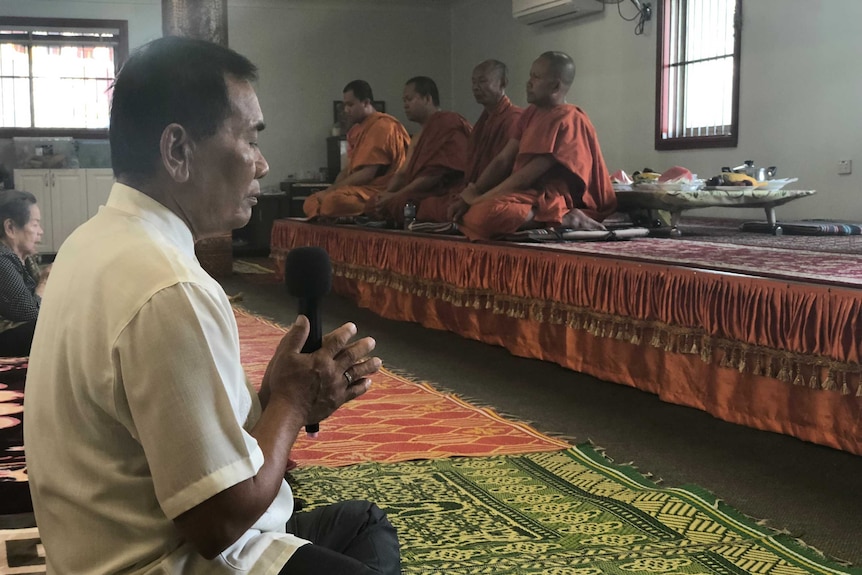 People pray at Watt Khemarangsaram in Sydney