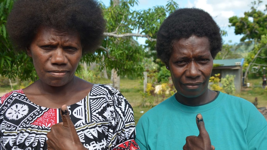 Vanuatu voters show off their ink-stained fingers