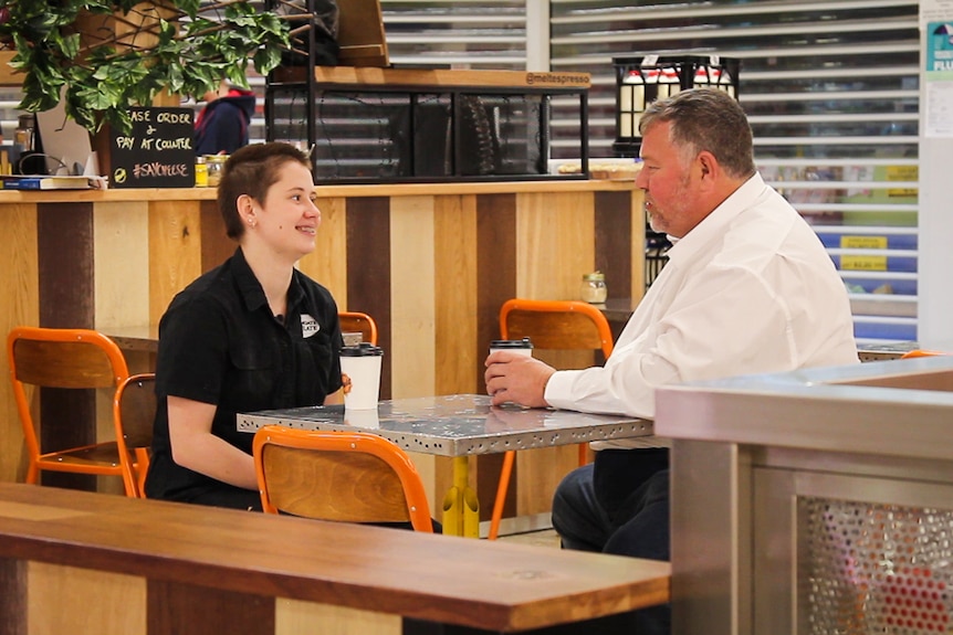 Apprentice butcher Sarah Wadland and her father Geoffrey sitting at a cafe.