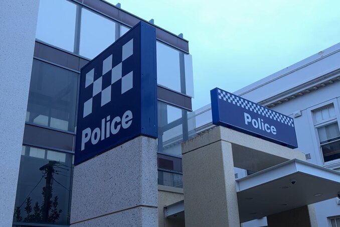 Mildura police station. Photo taken from outside; looking up at police station sign. Cloudy.