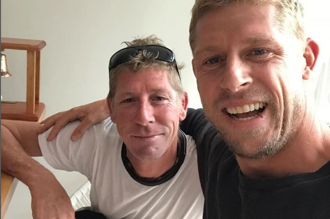 edwards Fanning smiling with his brother Mick fanning