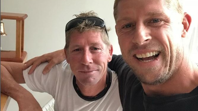 edwards Fanning smiling with his brother Mick fanning
