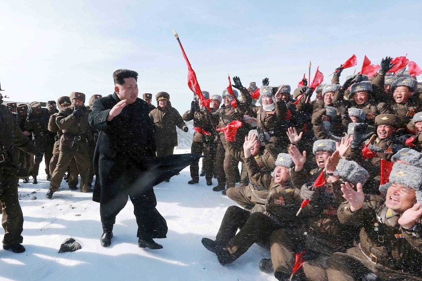 Kim Jong-Un greets Korean People's Army pilots