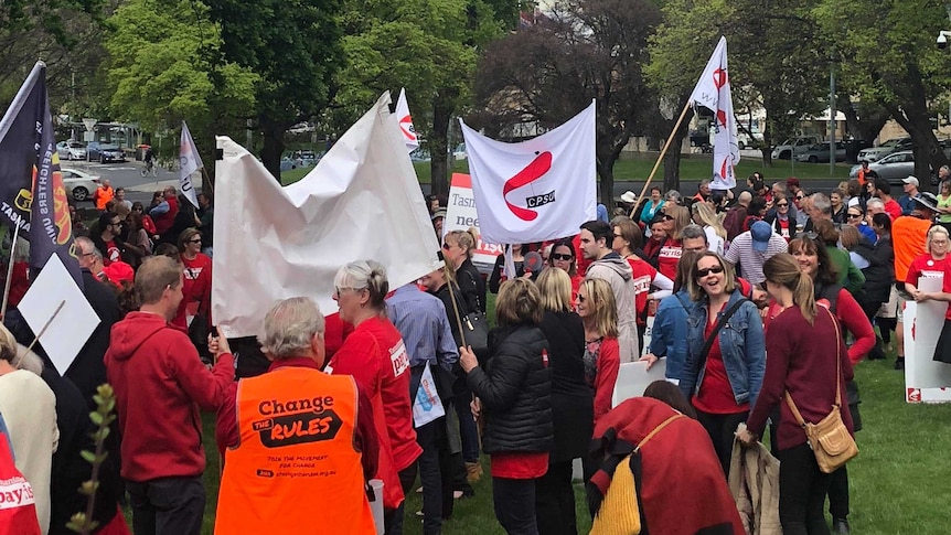 Public sector workers rally over a wage dispute outside Tasmanian Parliament.