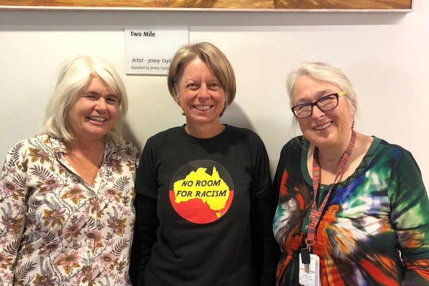 Dr Penny Stewart and Dr Christine Sanderson standing with Jodie Clarkson.