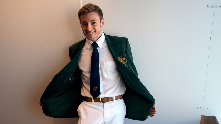 Golden threads ... diver Matthew Mitcham models the Australian team jacket.