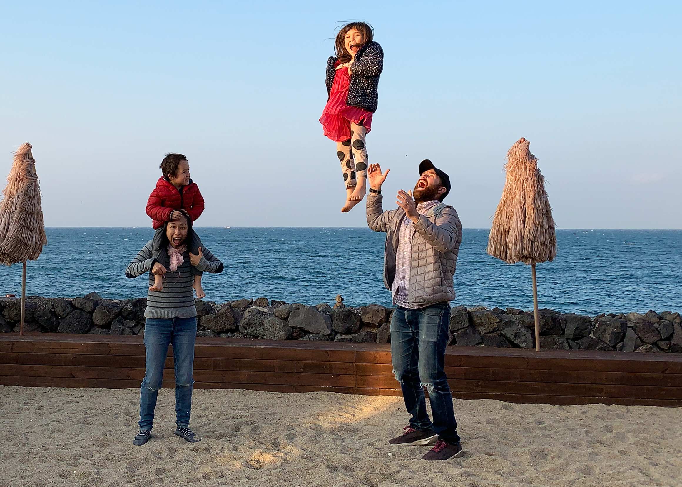 Family shot of David Stuart with wife Junko and kids Juna and Remy enjoying the beachside in Jeju, South Korea.