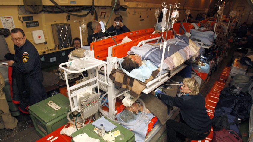 Rescuers treat Russian burns victims