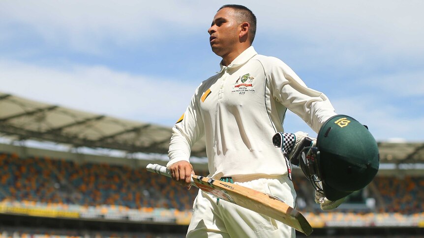 Solid knock ... Usman Khawaja leaves the field to the applause of the Gabba crowd