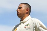Solid knock ... Usman Khawaja leaves the field to the applause of the Gabba crowd