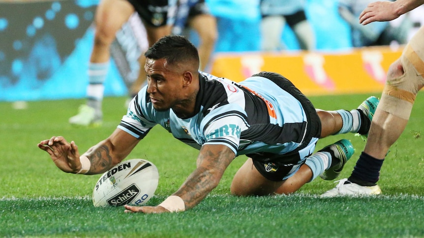 Ben Barba slides over for the first try of the 2016 grand final.