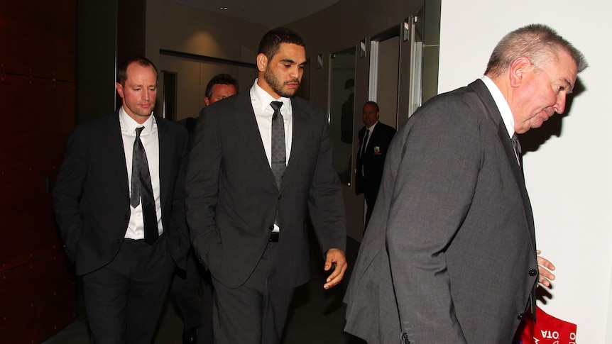 Judiciary visit ... Greg Inglis (C) exits with Rabbitohs coach Michael Maguire (L) and chief executive Shane Richardson after appearing at Rugby League Central