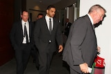 Not happy ... Greg Inglis (C) exits Rugby League Central with Rabbitohs coach Michael Maguire (L) and chief executive Shane Richardson