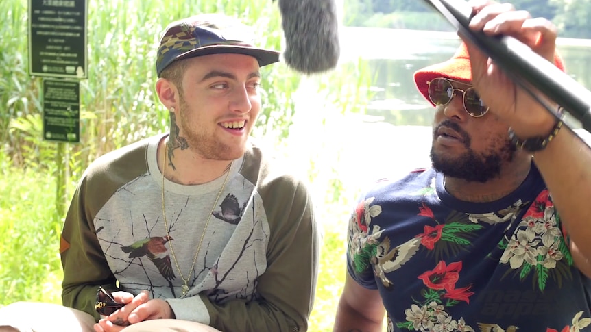 Mac Miller and Schoolboy Q by a lake