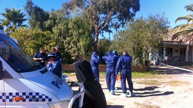 Forensic police at the Rockingham Road property.
