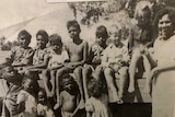Black-and-white photo of Indigenous children posing for a school picture.