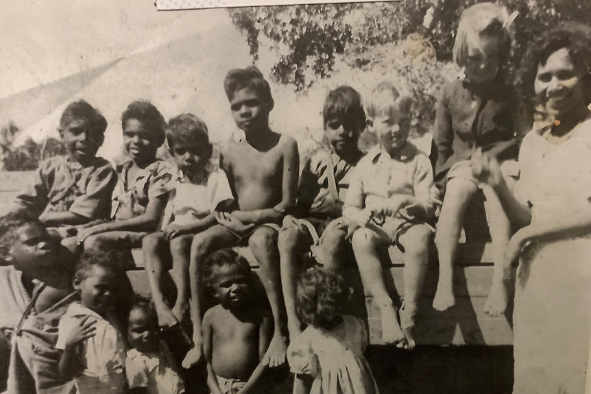 black and white photo of Indigenous children posing for a school photo