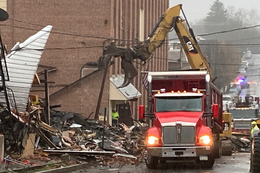 Crane truck outside the site of a deadly explosion at a chocolate factory.