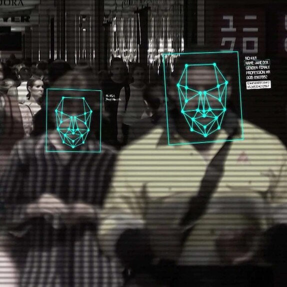 Street scene with people's faces overlaid with computer scanning graphics