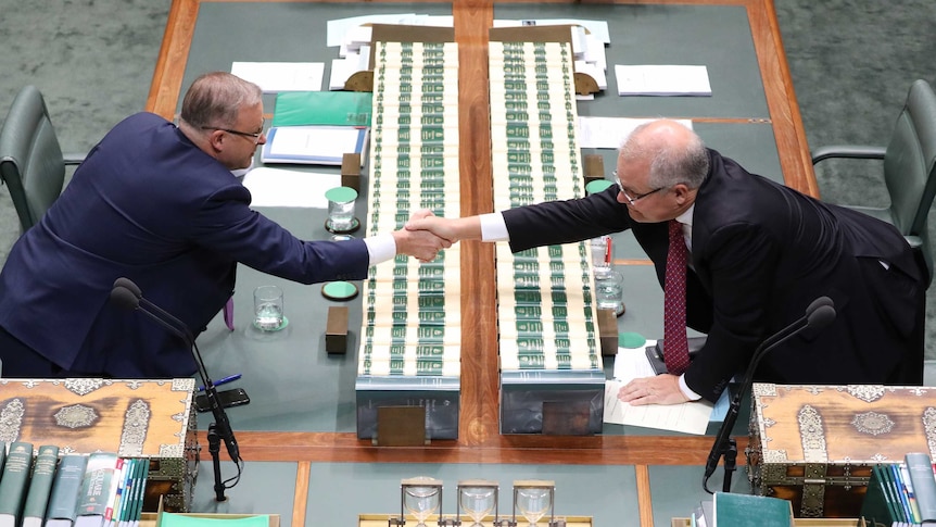 Prime Minister Scott Morrison shakes hands with Opposition Leader Anthony Albanese in the Lower House of Parliament