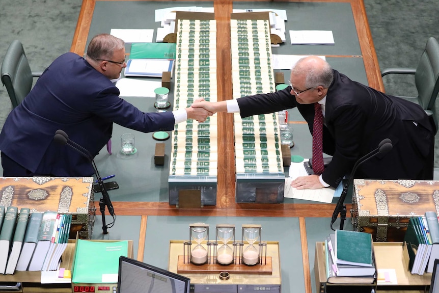 Prime Minister Scott Morrison shakes hands with Opposition Leader Anthony Albanese in the Lower House of Parliament