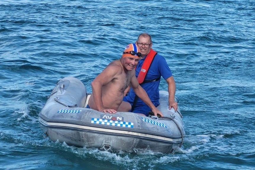 Two men on a dinghy in the ocean