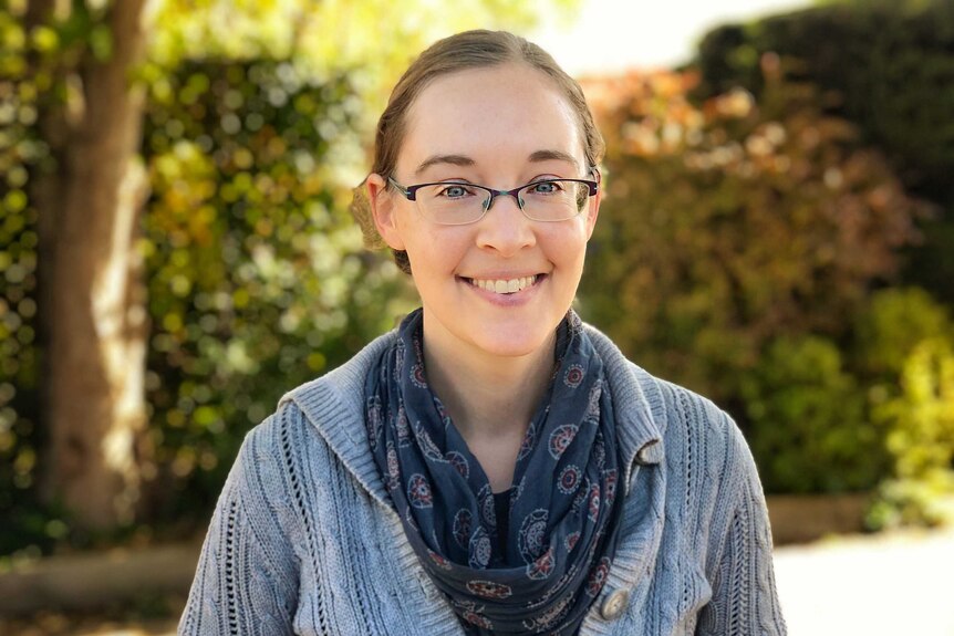 A portrait of smiling young woman.