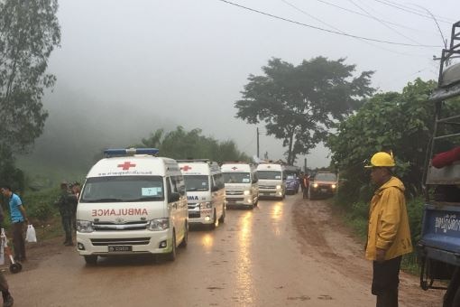 A row of ambulances heads into the cave site amid reports the rescue is underway or imminent.