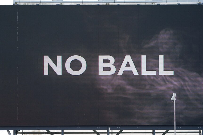 A big screen shows "no ball" during an Ashes Test at Old Trafford.