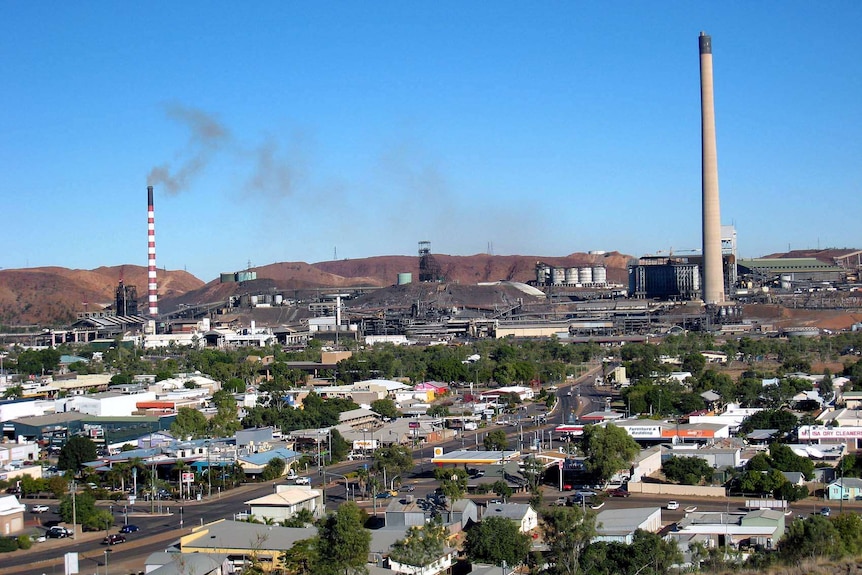 Smoke stacks overhang the streets of Mount Isa