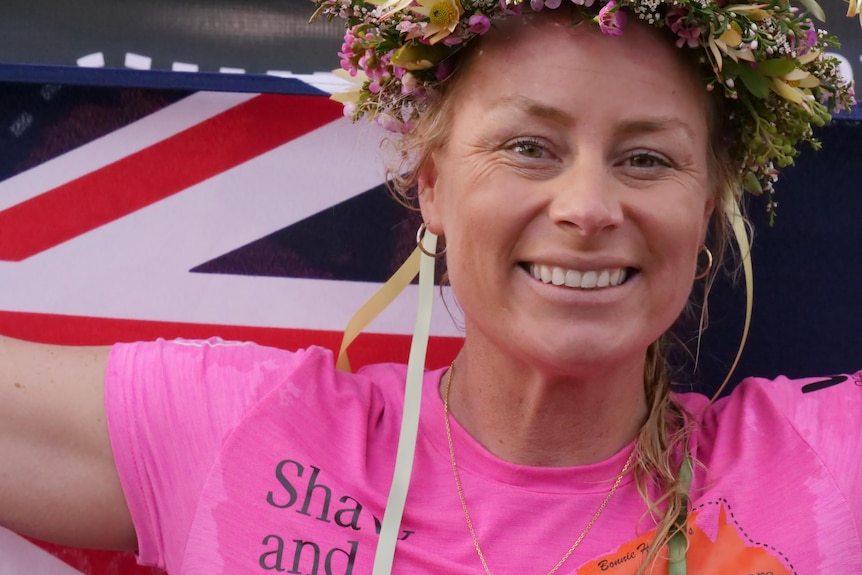 woman smiling holding australian flag