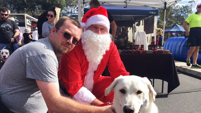 James Beel with his pet labrador Zac and Santa Claus