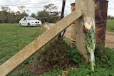 A floral tribute for a mother and two children