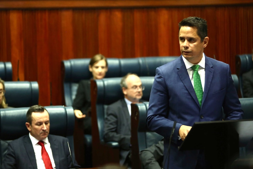 WA Treasurer Ben Wyatt address parliament as Premier Mark McGowan and Labor MPs look on