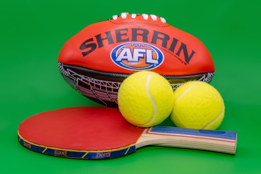 A photo of a football with tennis balls.