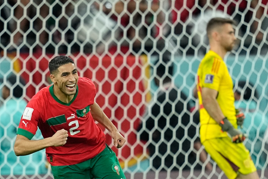 Morocco's Achraf Hakimi celebrates after scoring as the forlorn goalkeeper is seen in the background