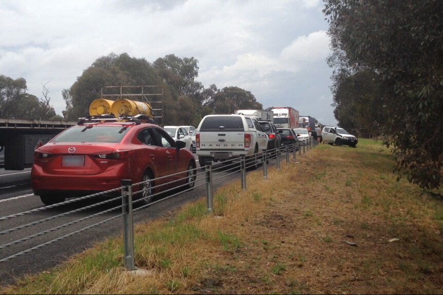 Cars backed up on the Hume Freeway facing difference directions.