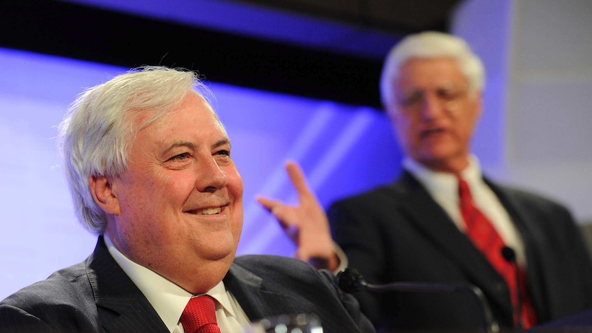 Clive Palmer smiles as Bob Katter speaks at the National Press Club